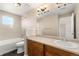 Bright bathroom with a shower-tub, tile surround, and a single-sink vanity at 8571 Gold Peak Dr # C, Highlands Ranch, CO 80130