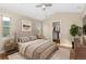 Vaulted-ceiling primary bedroom with ample natural light, closet, and neutral decor at 8571 Gold Peak Dr # C, Highlands Ranch, CO 80130