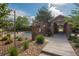 Community pool area features a stone structure and gated access, perfect for relaxation and recreation at 8571 Gold Peak Dr # C, Highlands Ranch, CO 80130