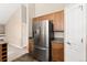 View of kitchen area with stainless steel refrigerator and ample cabinet space at 8571 Gold Peak Dr # C, Highlands Ranch, CO 80130