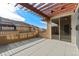 Private deck featuring pavers, wood pergola, and sliding glass door access to interior at 8571 Gold Peak Dr # C, Highlands Ranch, CO 80130