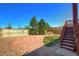 Backyard featuring a patio, grass, and surrounding fence and trees at 16893 Trail View Cir, Parker, CO 80134