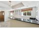 Modern basement featuring a stylish wet bar with elegant countertop, and neutral wall color at 16893 Trail View Cir, Parker, CO 80134