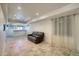 Finished basement with tiled flooring, wet bar, recessed lighting, and comfortable seating at 16893 Trail View Cir, Parker, CO 80134