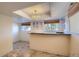Finished basement wet bar area features tiled flooring, granite countertop, and recessed lighting at 16893 Trail View Cir, Parker, CO 80134