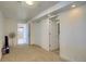 Carpeted basement area provides access to closet space and bathroom with tiled floors at 16893 Trail View Cir, Parker, CO 80134