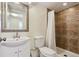 A well-lit bathroom with a shower and a decorative-framed mirror above the vanity at 16893 Trail View Cir, Parker, CO 80134