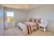 Comfortable bedroom featuring a ceiling fan, closet, large window and carpeted floor at 16893 Trail View Cir, Parker, CO 80134
