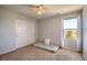 Simple bedroom featuring a ceiling fan, closet, sunny window and carpeted floor at 16893 Trail View Cir, Parker, CO 80134