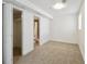 Carpeted bedroom with closet and bathroom featuring tile floor, toilet, and bathtub with shower at 16893 Trail View Cir, Parker, CO 80134