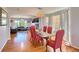 Elegant dining area with hardwood floors, stylish chandelier, and seating for six at 16893 Trail View Cir, Parker, CO 80134