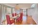 Inviting dining space with wood flooring, large windows, and stylish table setting at 16893 Trail View Cir, Parker, CO 80134