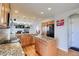 Bright kitchen with granite countertops, central island, stainless appliances, and open layout to the living room at 16893 Trail View Cir, Parker, CO 80134