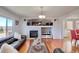 Spacious living room featuring a cozy fireplace, large windows, and ample seating at 16893 Trail View Cir, Parker, CO 80134