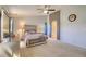 Spacious main bedroom with a ceiling fan, carpet, a closet, and sunny windows at 16893 Trail View Cir, Parker, CO 80134