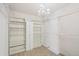 Large walk-in closet with built-in shelving, clothing racks and chandelier lighting at 16893 Trail View Cir, Parker, CO 80134
