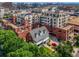 Aerial view of the building showcasing its architectural design and surrounding greenery at 410 Acoma St # 518, Denver, CO 80204