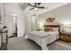 Cozy bedroom with soft carpet, ceiling fan, and stylish decor, offering a serene atmosphere for rest and relaxation at 410 Acoma St # 518, Denver, CO 80204
