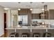 Modern kitchen boasts stainless steel appliances, granite countertops, sleek cabinetry, and a stylish island with seating at 410 Acoma St # 518, Denver, CO 80204