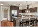 Modern kitchen boasts stainless steel appliances, granite countertops, sleek cabinetry, and a stylish island with seating at 410 Acoma St # 518, Denver, CO 80204