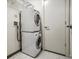 Convenient laundry room with stacked washer and dryer maximizing space and efficiency at 410 Acoma St # 518, Denver, CO 80204