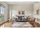 Stylish living room with hardwood floors, modern decor, and natural light from balcony at 410 Acoma St # 518, Denver, CO 80204