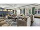 Inviting living room with ample seating, modern decor, and natural light streaming through large windows at 410 Acoma St # 518, Denver, CO 80204
