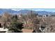 A beautiful mountain and city view across rooftops from a residential neighborhood in the city at 410 Acoma St # 518, Denver, CO 80204