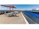 Inviting rooftop deck offering a dining area, grill, and mountain views at 410 Acoma St # 518, Denver, CO 80204