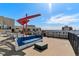 Relaxing rooftop deck featuring comfortable seating and an outdoor grill area at 410 Acoma St # 518, Denver, CO 80204