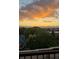 Beautiful sunset view from the balcony showcasing the vibrant sky and mountain range at 410 Acoma St # 518, Denver, CO 80204