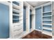Spacious walk-in closet with custom shelving and drawers maximizes storage at 15909 E Ford Pl, Aurora, CO 80017