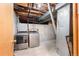 Basement utility room has a washer, dryer, and unfinished walls at 15909 E Ford Pl, Aurora, CO 80017