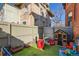 -friendly backyard with artificial turf, a playhouse and toy storage at 1351 N Franklin St, Denver, CO 80218