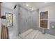 Modern bathroom with frameless glass shower, subway tile, and marble flooring at 1351 N Franklin St, Denver, CO 80218