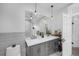 This large bathroom features a double sink vanity, subway tiled wall and modern fixtures at 1351 N Franklin St, Denver, CO 80218