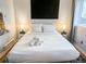 Comfortable bedroom featuring a king-size bed, soft white bedding, and ample natural light at 1351 N Franklin St, Denver, CO 80218