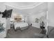 This large bedroom offers a sitting area, a dresser, and a view of the neighborhood at 1351 N Franklin St, Denver, CO 80218