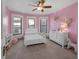 A cheerful ' bedroom with pink walls and a plush rocking unicorn, ample space at 1351 N Franklin St, Denver, CO 80218