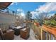 Inviting deck featuring comfortable outdoor furniture, planters, and sunny view at 1351 N Franklin St, Denver, CO 80218