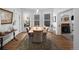 Elegant dining room with hardwood floors, large windows, and a long wooden table at 1351 N Franklin St, Denver, CO 80218