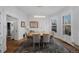 Bright dining room features hardwood floors, bay windows and modern lighting fixture at 1351 N Franklin St, Denver, CO 80218