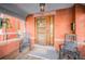 Inviting front porch with rocking chairs, a classic wooden door, and brick facade at 1351 N Franklin St, Denver, CO 80218