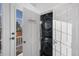 Convenient laundry room equipped with a modern, stacked washer and dryer unit at 1351 N Franklin St, Denver, CO 80218