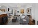 Comfortable living room featuring a fireplace, hardwood floors, and stylish decor at 1351 N Franklin St, Denver, CO 80218