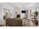 Inviting living room with a fireplace, chandelier, comfortable seating, and ample natural light at 1351 N Franklin St, Denver, CO 80218