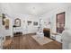 Cozy living room with fireplace, chandelier, and hardwood floors; perfect for relaxation at 1351 N Franklin St, Denver, CO 80218