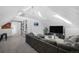 Spacious loft living room with vaulted ceilings, built-in shelves and cozy seating at 1351 N Franklin St, Denver, CO 80218