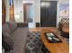 Relaxing living area with comfortable sofa, exposed brick, and view into another room at 1351 N Franklin St, Denver, CO 80218
