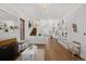 Bright living room featuring hardwood floors, a fireplace, and elegant decor at 1351 N Franklin St, Denver, CO 80218